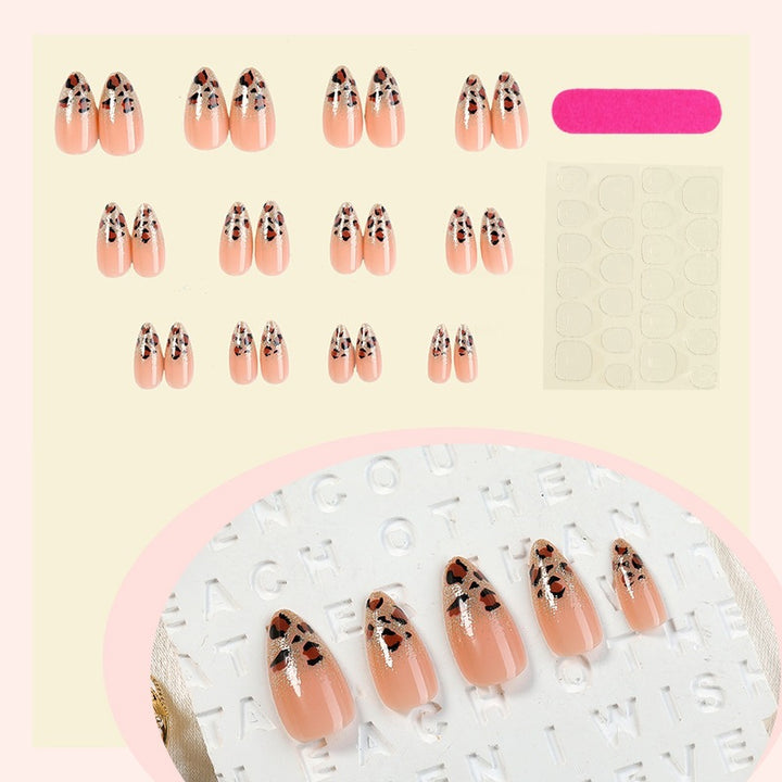 Nail art set with elegant leopard pattern and glitter accents Stornfield
