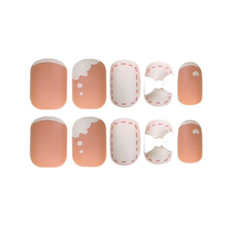 Artistic nail nails with decorative bow designs and French tips Stornfield