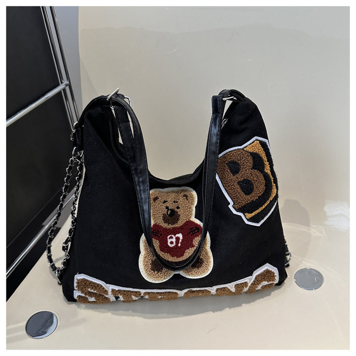 Shoulder bag in playful bear pattern Stornfield