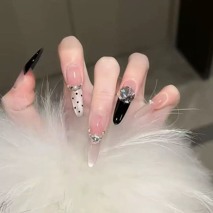Acrylic nail set with elegant tips and glamorous rhinestone accents Stornfield