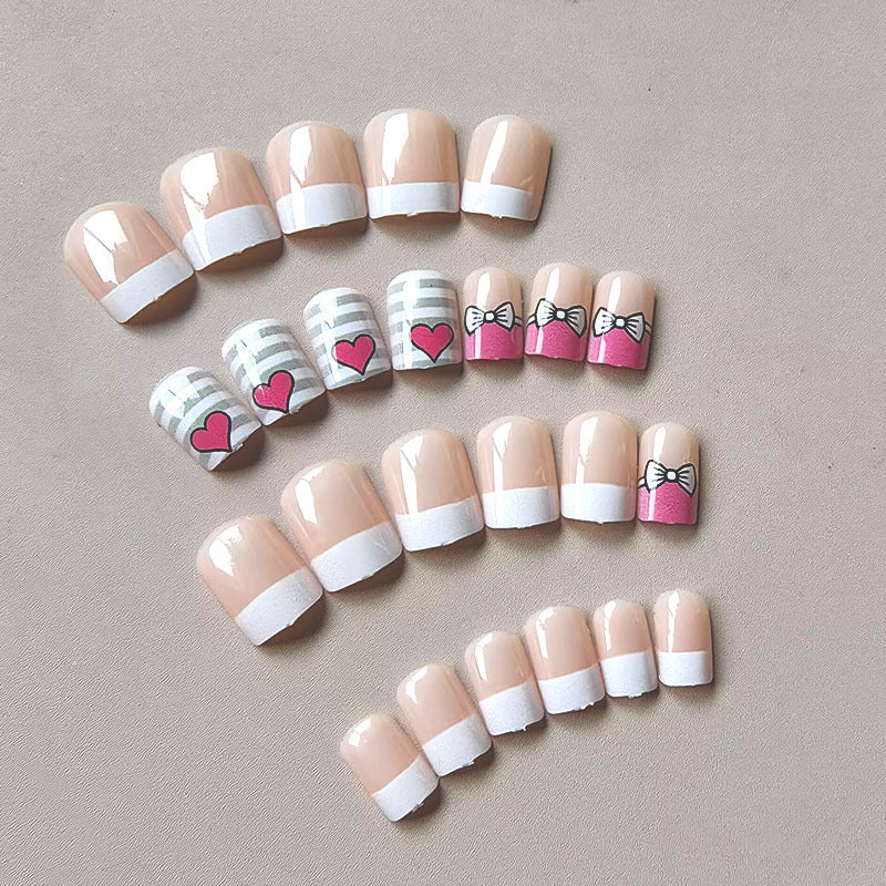Artificial nails with playful heart and bow pattern Stornfield