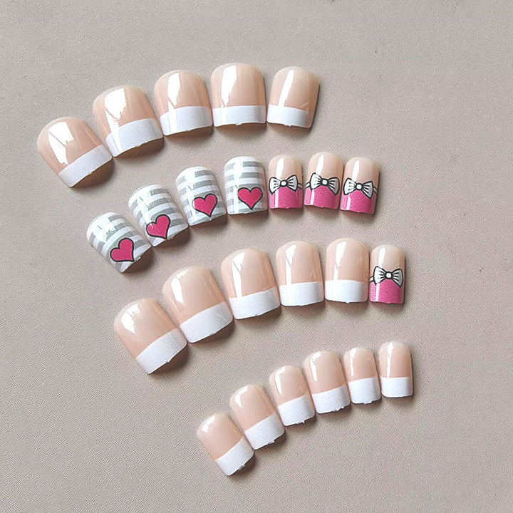 Artificial nails with playful heart and bow pattern Stornfield
