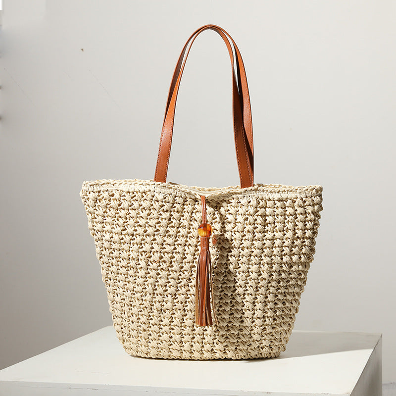 Handcrafted basket bag with fashionable tassel detail Stornfield