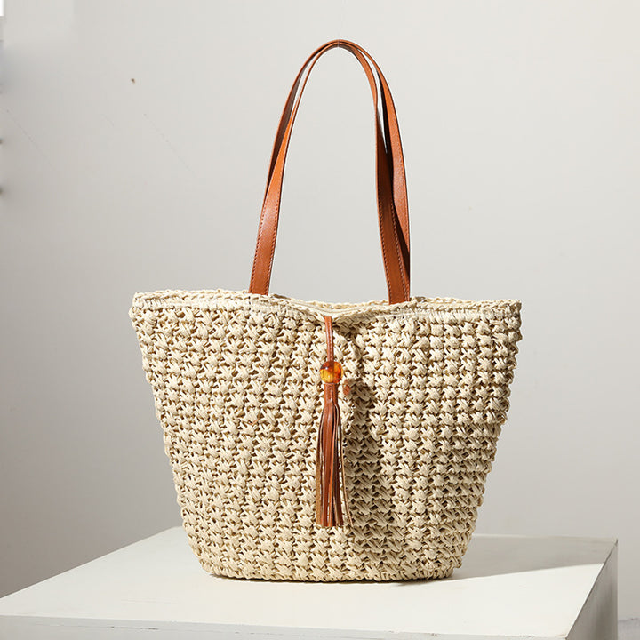 Handcrafted basket bag with fashionable tassel detail Stornfield