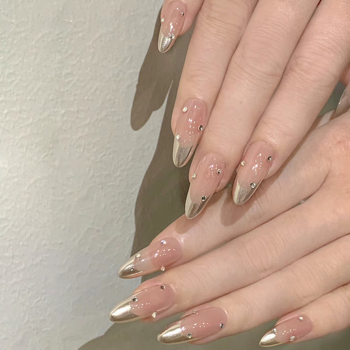 Artificial nail set with elegant metallic shades and rhinestone decorations Stornfield