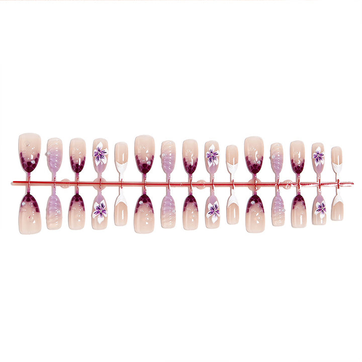 Artificial nails with elegant ombre effects and floral accents Stornfield