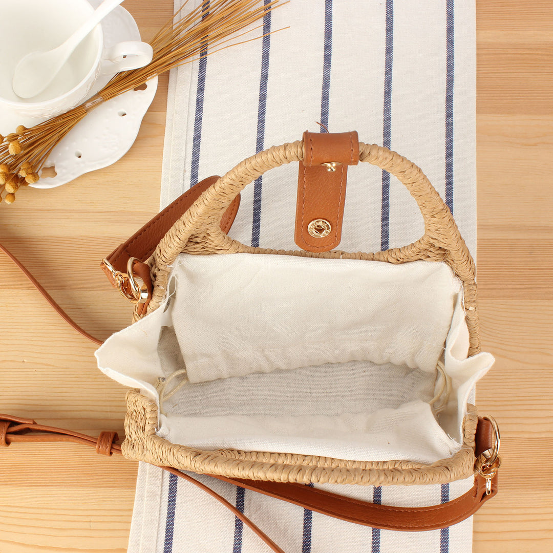Shoulder bag made of woven natural material with elegant leather accent Stornfield