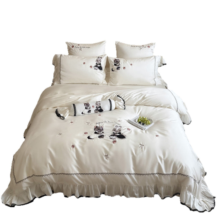 Romantic satin bed linen set with ruffled hem and embroidered animal appliqués Stornfield