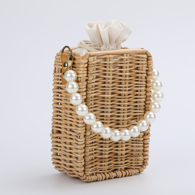 Women's handbag made of woven material with pearl accents Stornfield