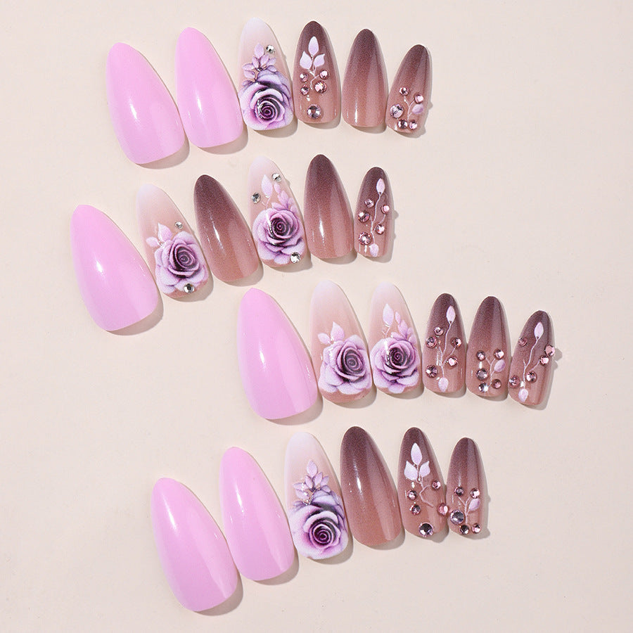 Creative nail art set with elegant rose accents and soft color gradient Stornfield
