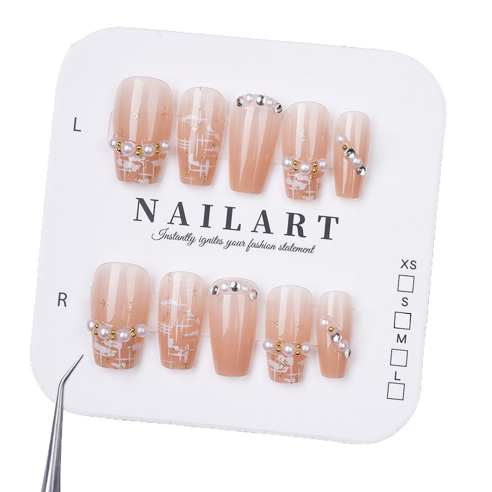 Artificial nails with elegant pearl and glitter decorations Stornfield