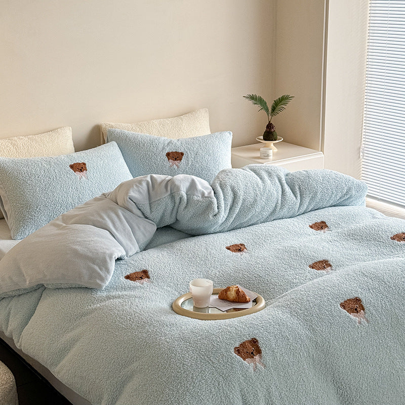 Cozy sherpa bedding set with embroidered penguin motifs and reversible function
