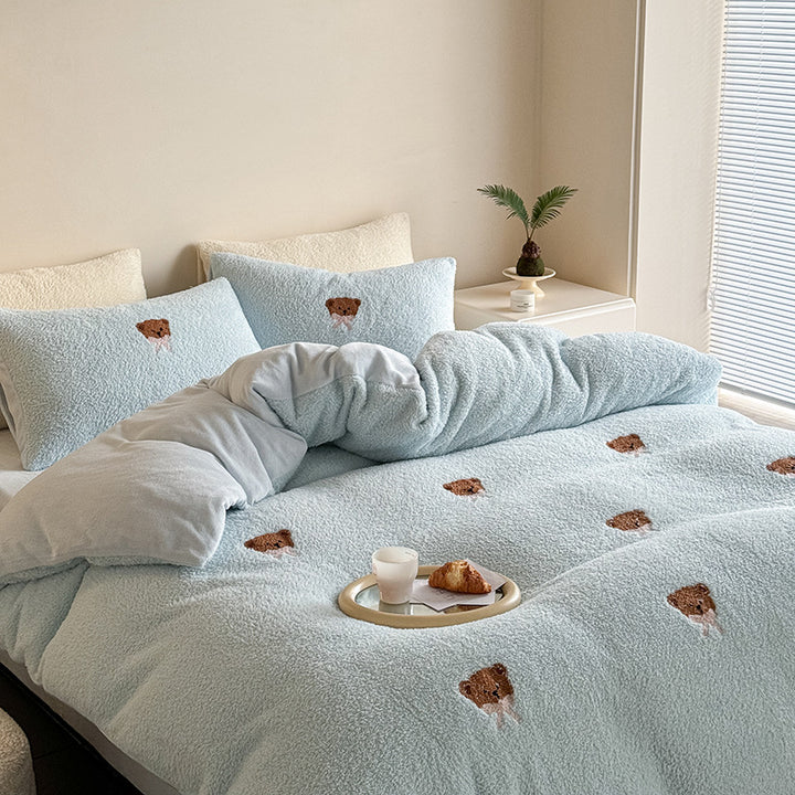 Cozy sherpa bedding set with embroidered penguin motifs and reversible function