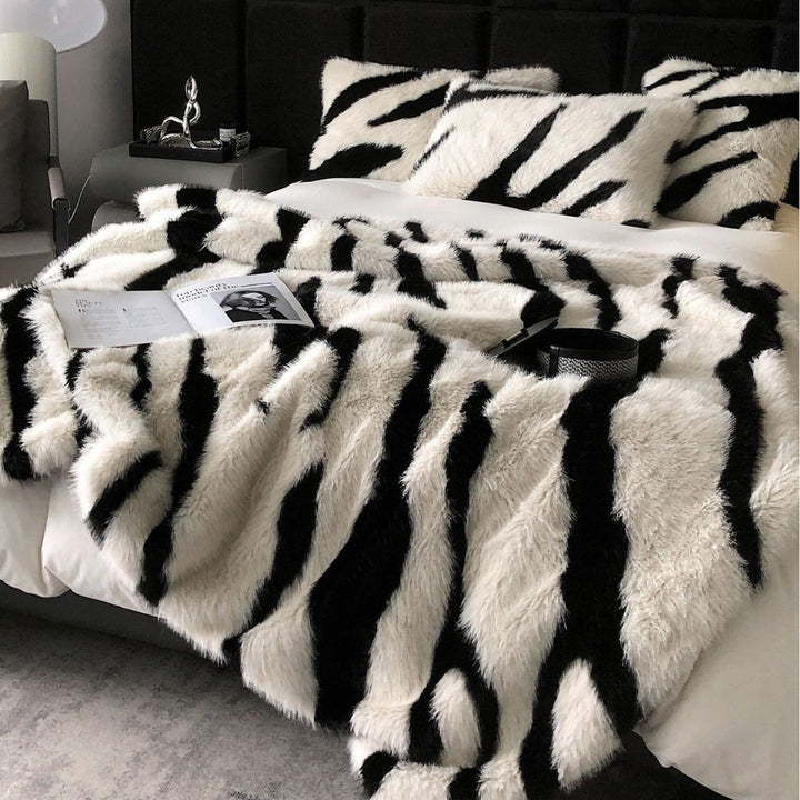 Faux fur bedspread with zebra design and extra fluffy texture