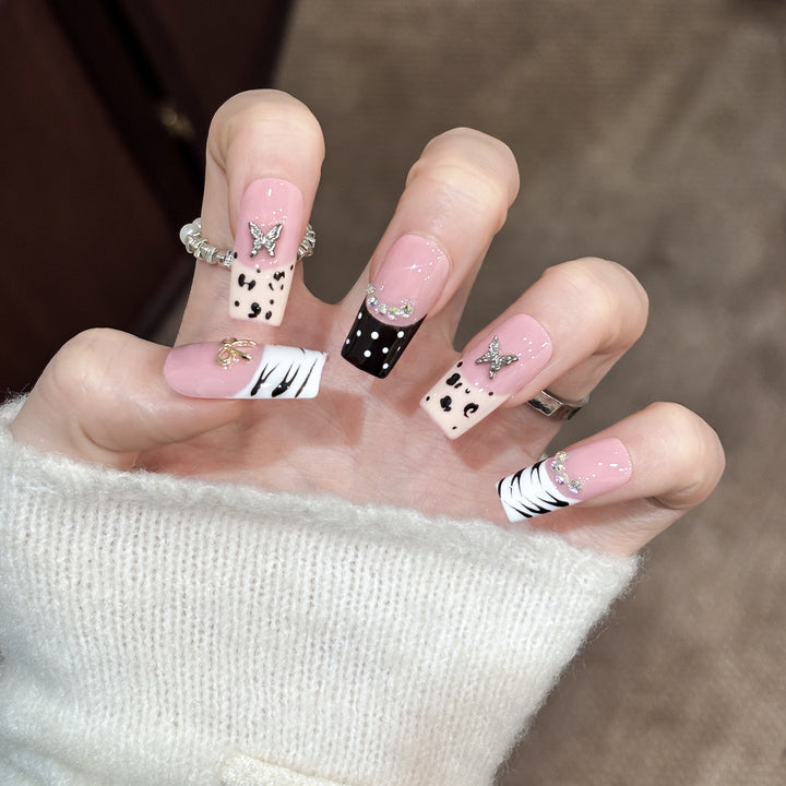Artistic Press-On Nail Enhancements with Pattern and Gem Accents