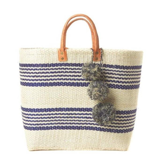 Stylish basket bag with playful pompons Stornfield