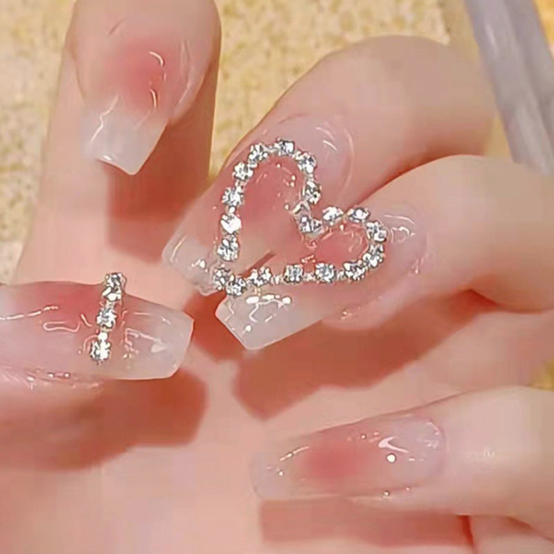 Artificial nails with romantic heart decorations Stornfield