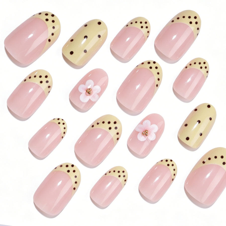 Artificial nail set with a cheerful floral design and elegant accents Stornfield