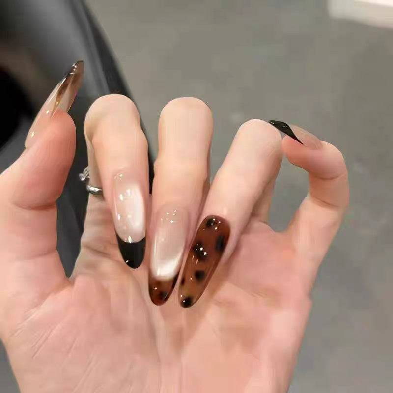 Artificial nails with elegant ombre effect and delicate rhinestone embellishments Stornfield