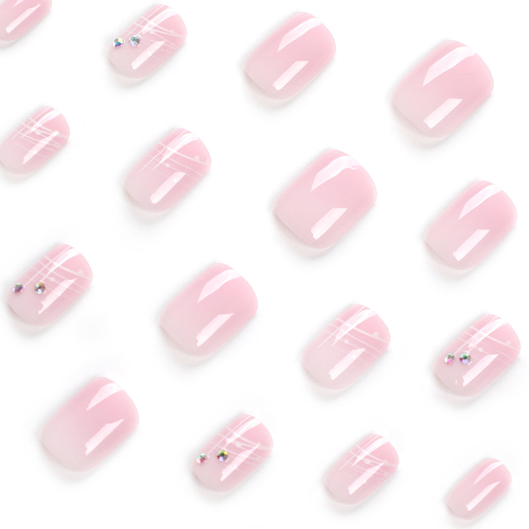 Artful nail extensions with elegant design and rhinestone embellishments Stornfield