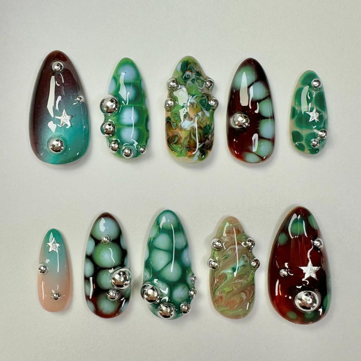 Creative artificial nails with 3D details and unique color accents Stornfield