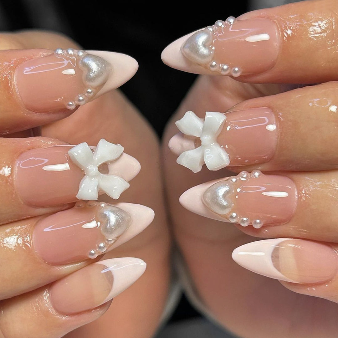 Artificial nail set with elegant pearl and bow decorations Stornfield