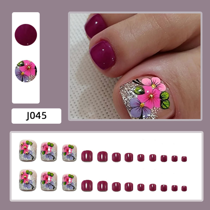 Artificial nails with floral designs and glitter effects Stornfield