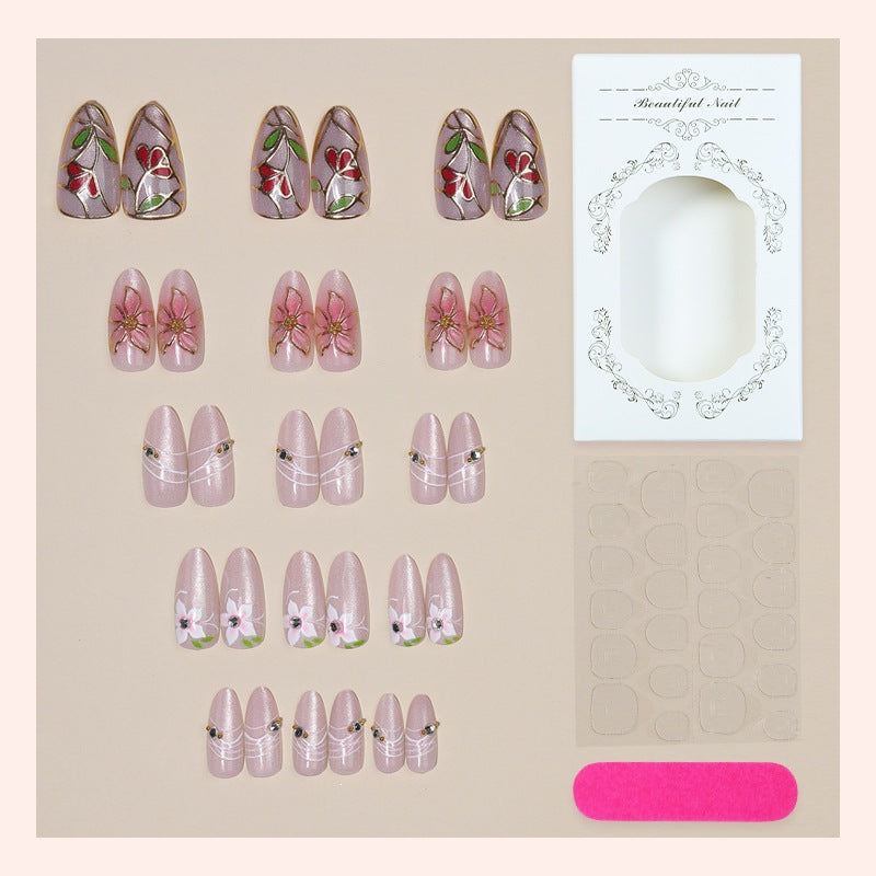 Artificial nail set with luxurious floral designs and glitter accents Stornfield