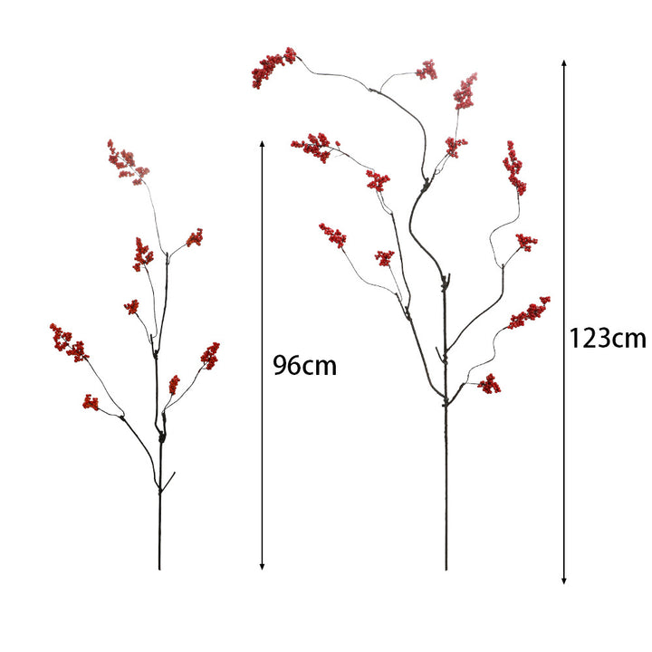 Decorative artificial flower branch with glowing red berries