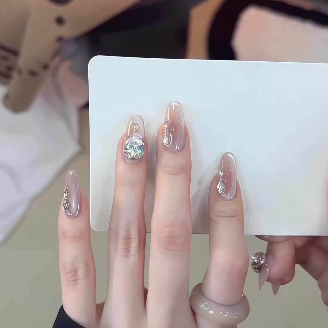 Glamorous artificial nails with rhinestone embellishments Stornfield