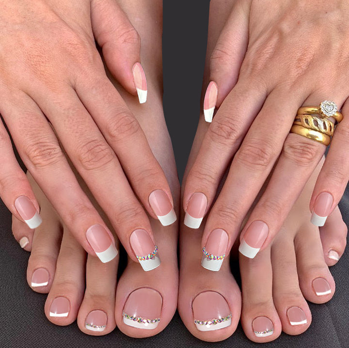 Acrylic nail set with elegant French design and rhinestone embellishments Stornfield