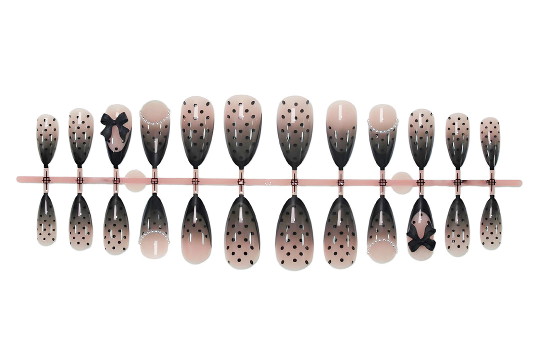 Nail art set with elegant dot and bow pattern Stornfield