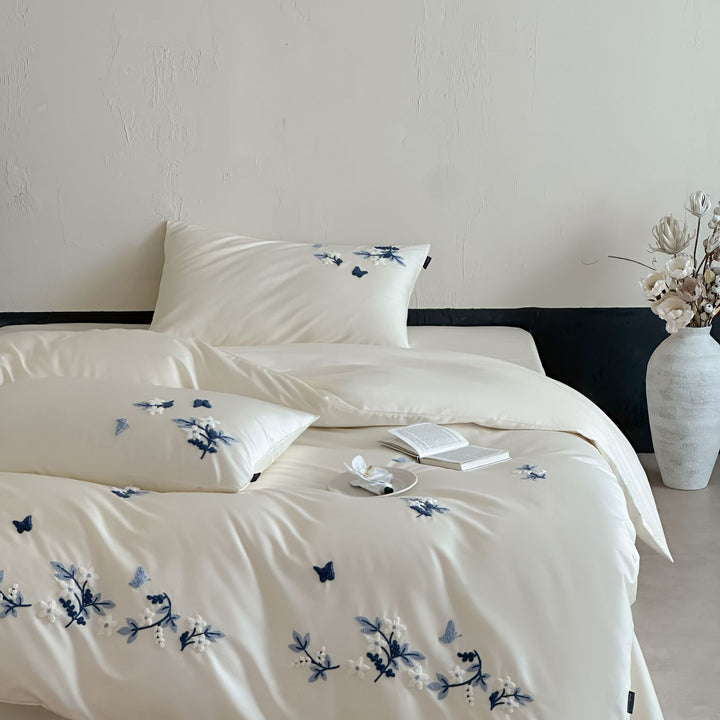 Luxurious satin bedding set with blue flower embroidery
