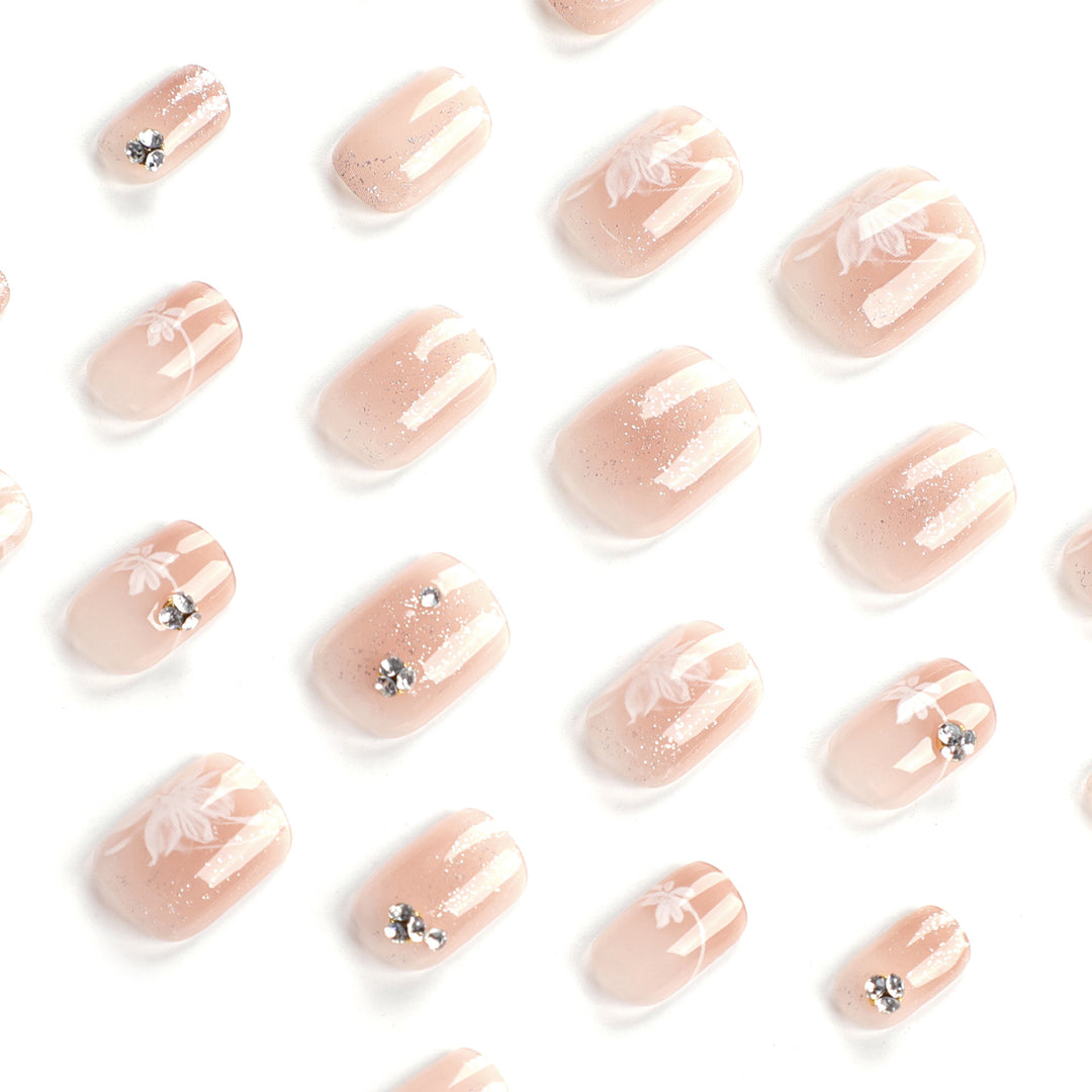 Elegant Nail Art with Holographic Accents and Floral Embellishments Stornfield