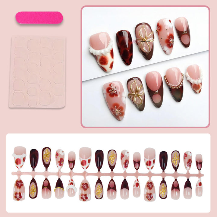 Artificial nail set with luxurious floral designs and glitter accents Stornfield
