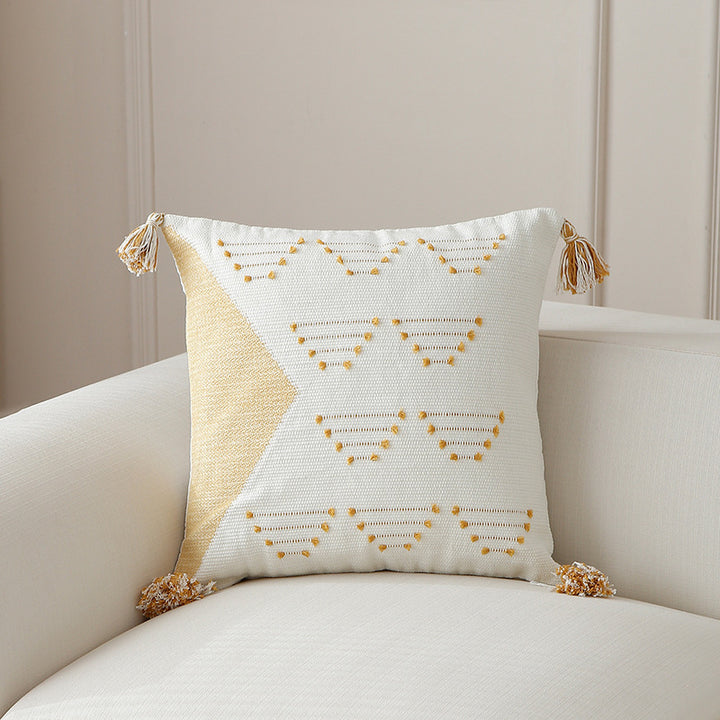 Decorative woven cushion cover with geometric tuft-relief and tassels Stornfield