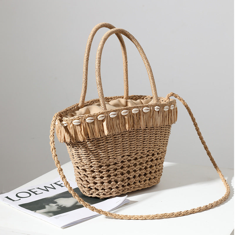 Braided straw bag with decorative tassel detail Stornfield