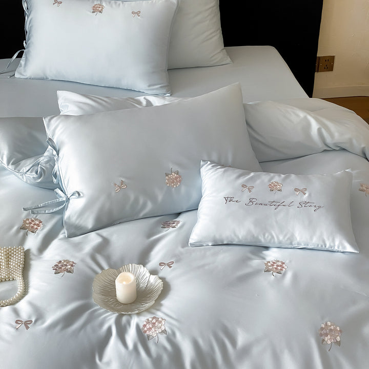 Cotton satin bedding set with delicate bow and flower embroidery as well as pillowcases