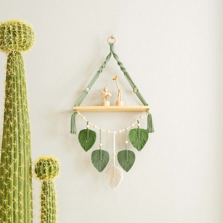 Macramé plant shelf with artistic leaf design