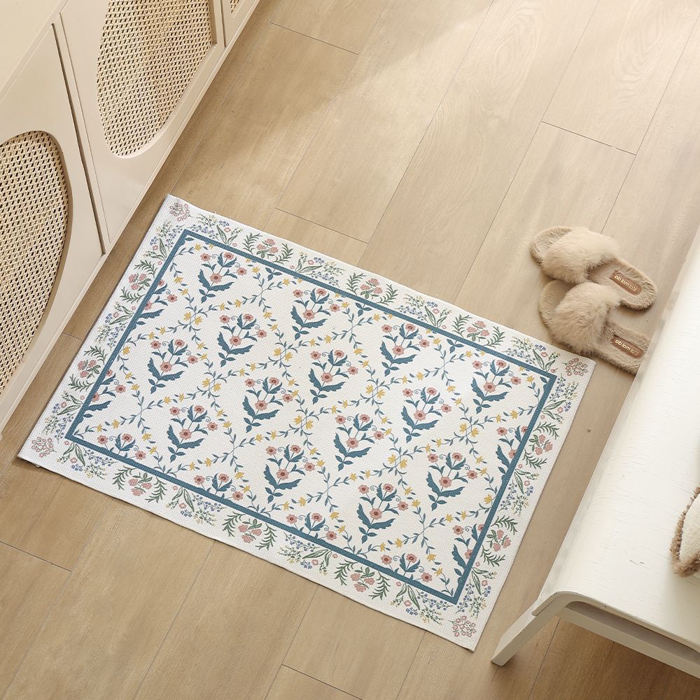 Flat-woven cotton runner with fine floral medallion decor and decorative border