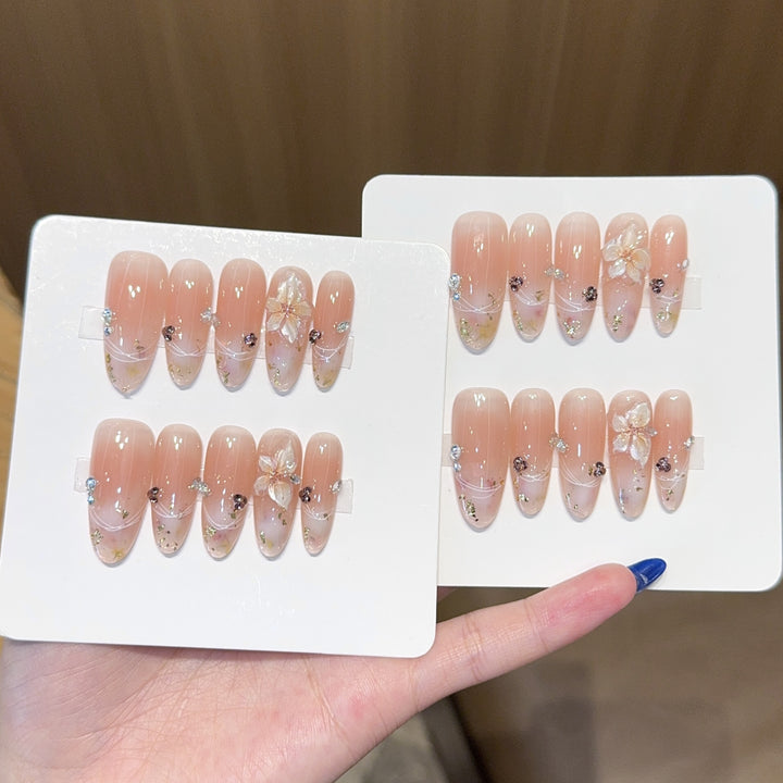 Artificial nails with delicate flower and glitter detail Stornfield