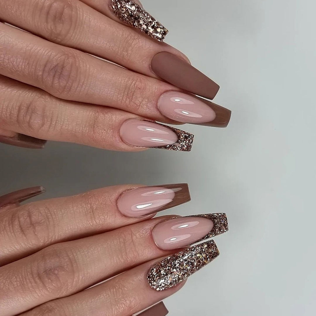Artful stiletto nails with glitter embellishments Stornfield