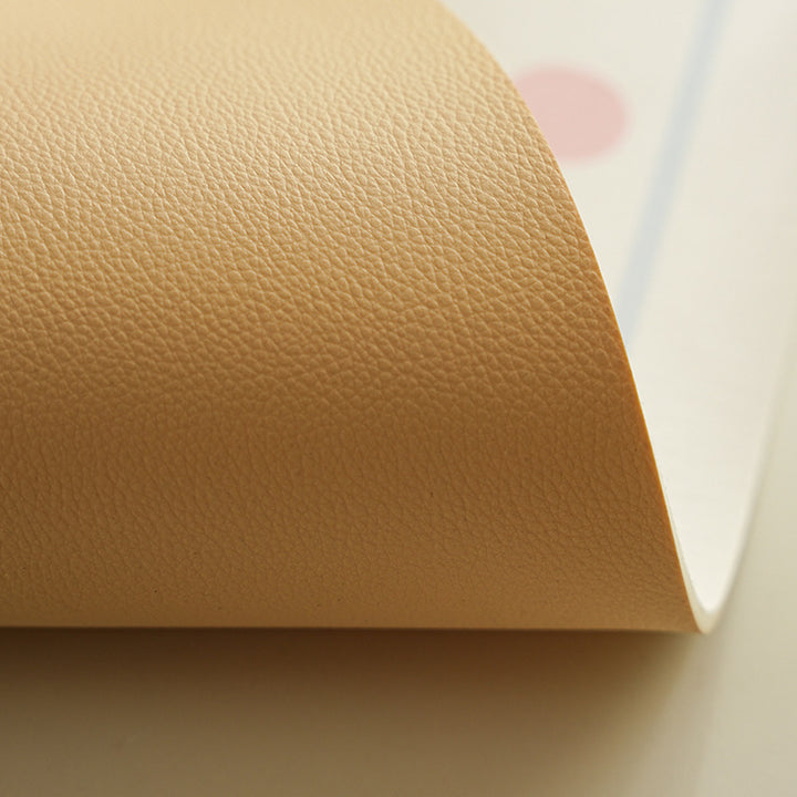 Oval wipeable placemat with pastel-colored polka dots Stornfield