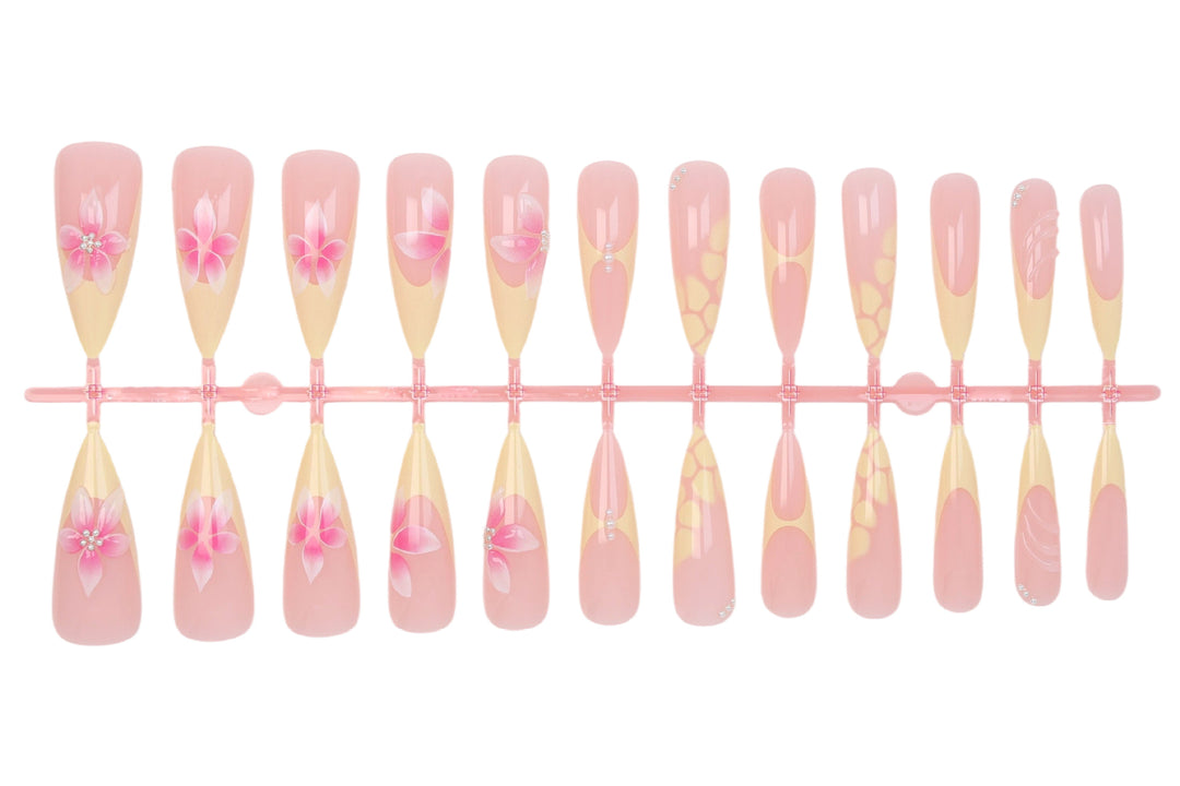 Acrylic nail set with elegant floral pattern and shimmering accents Stornfield