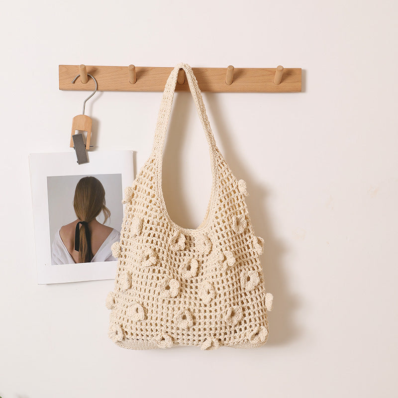 Hand-knotted shoulder bag with floral structural elements Stornfield