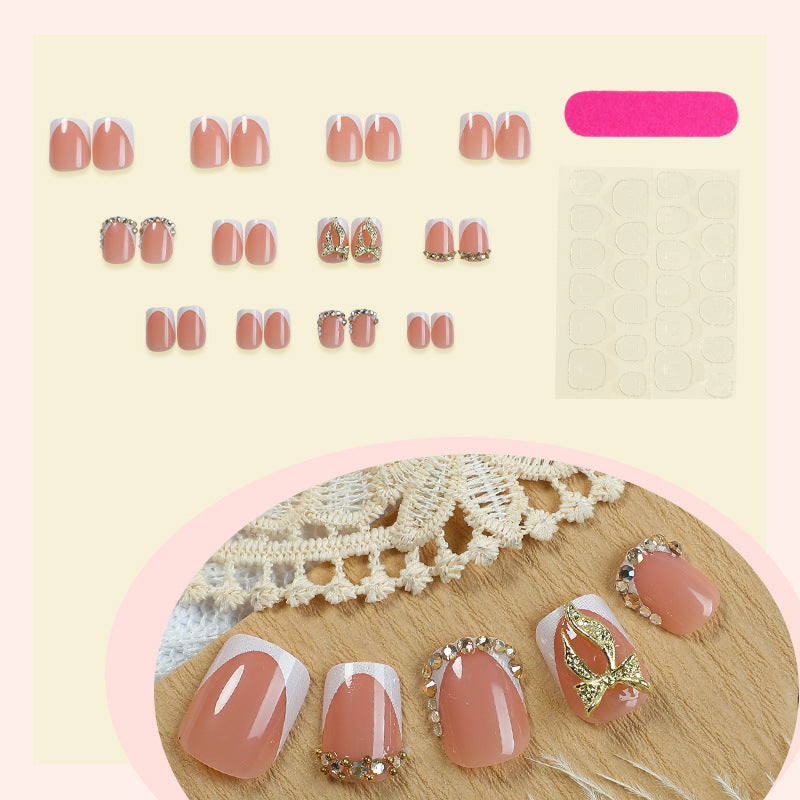 Artificial nail set with elegant glitter and flower decorations Stornfield