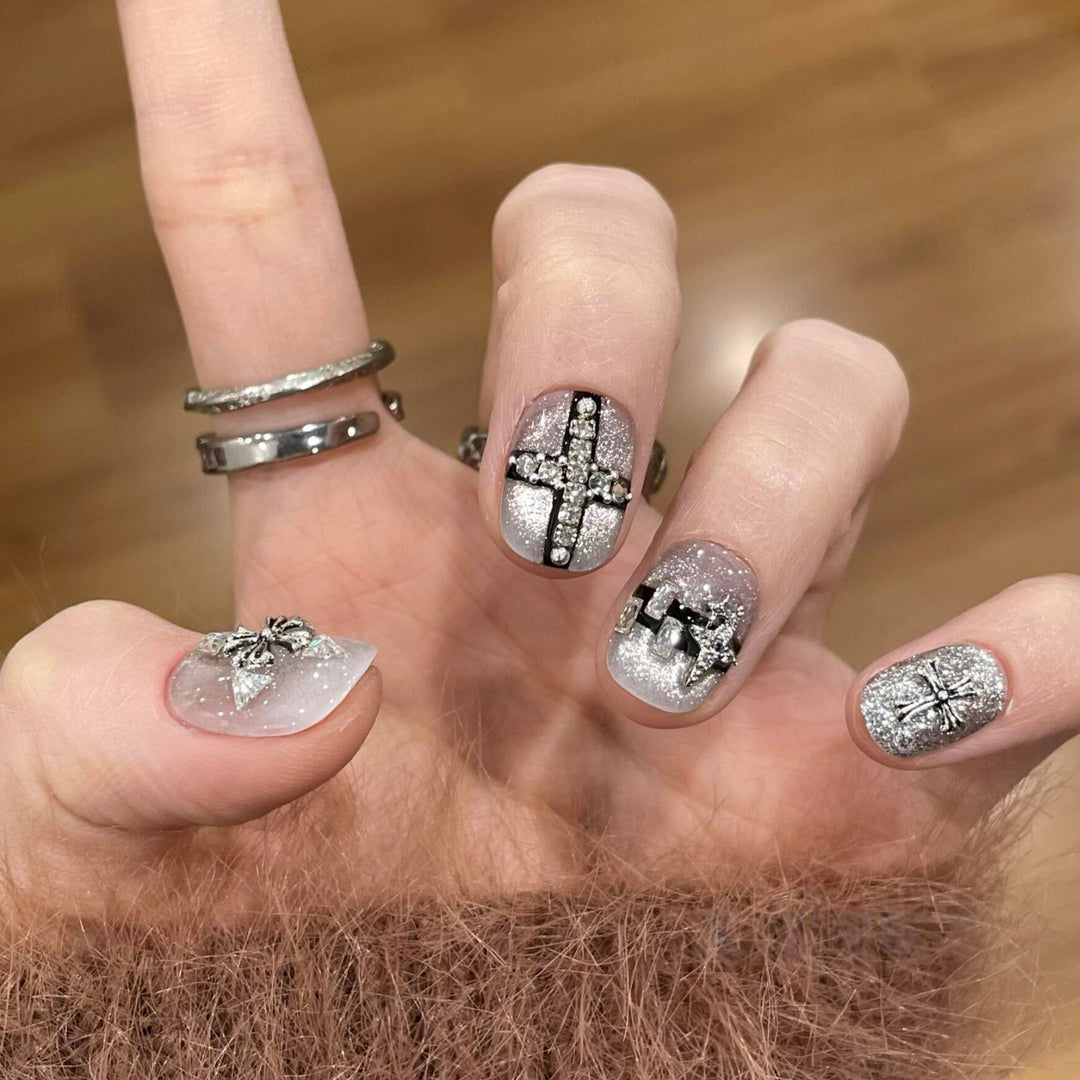 Glamorous artificial nails with rhinestone and glitter motifs Stornfield