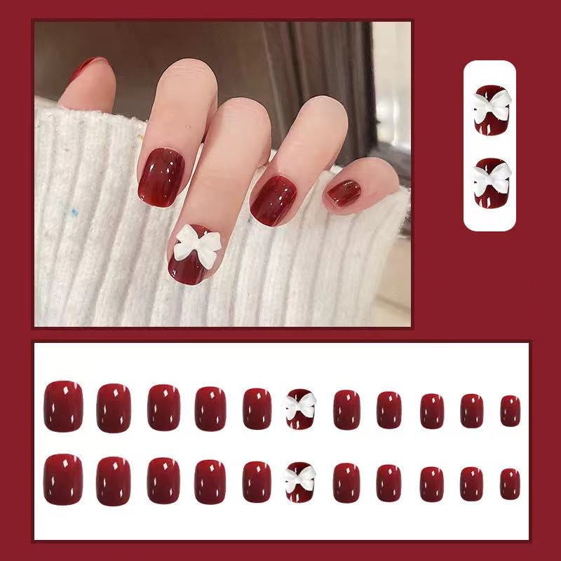 Artificial nails with elegant bow motifs Stornfield