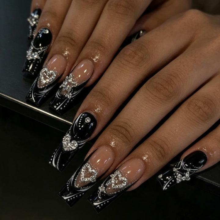 Artificial nails with elegant glitter accents and heart motifs Stornfield