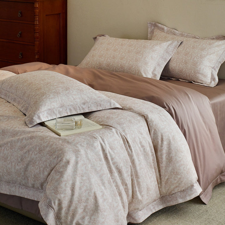 Luxurious cotton satin bed linen set with millefleurs floral pattern and fine piping